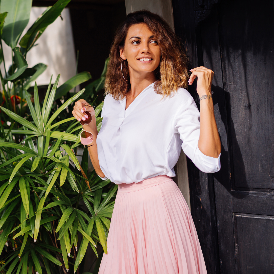 Woman in white blouse and pink skirt with sunglasses outdoors — Emmy & Ellie tops and blouses