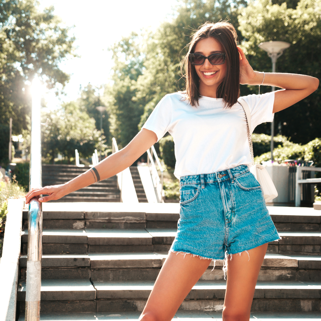 Woman in stylish casual shorts on sunny summer street — Emmy & Ellie women's shorts