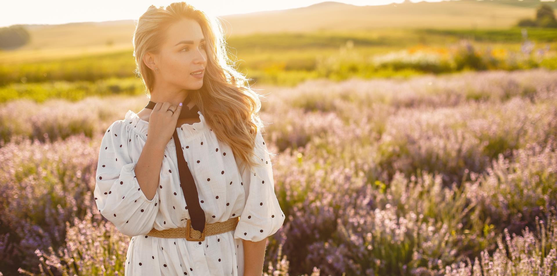 Woman in white floral dress standing in lavender field — Emmy & Ellie women's fashion